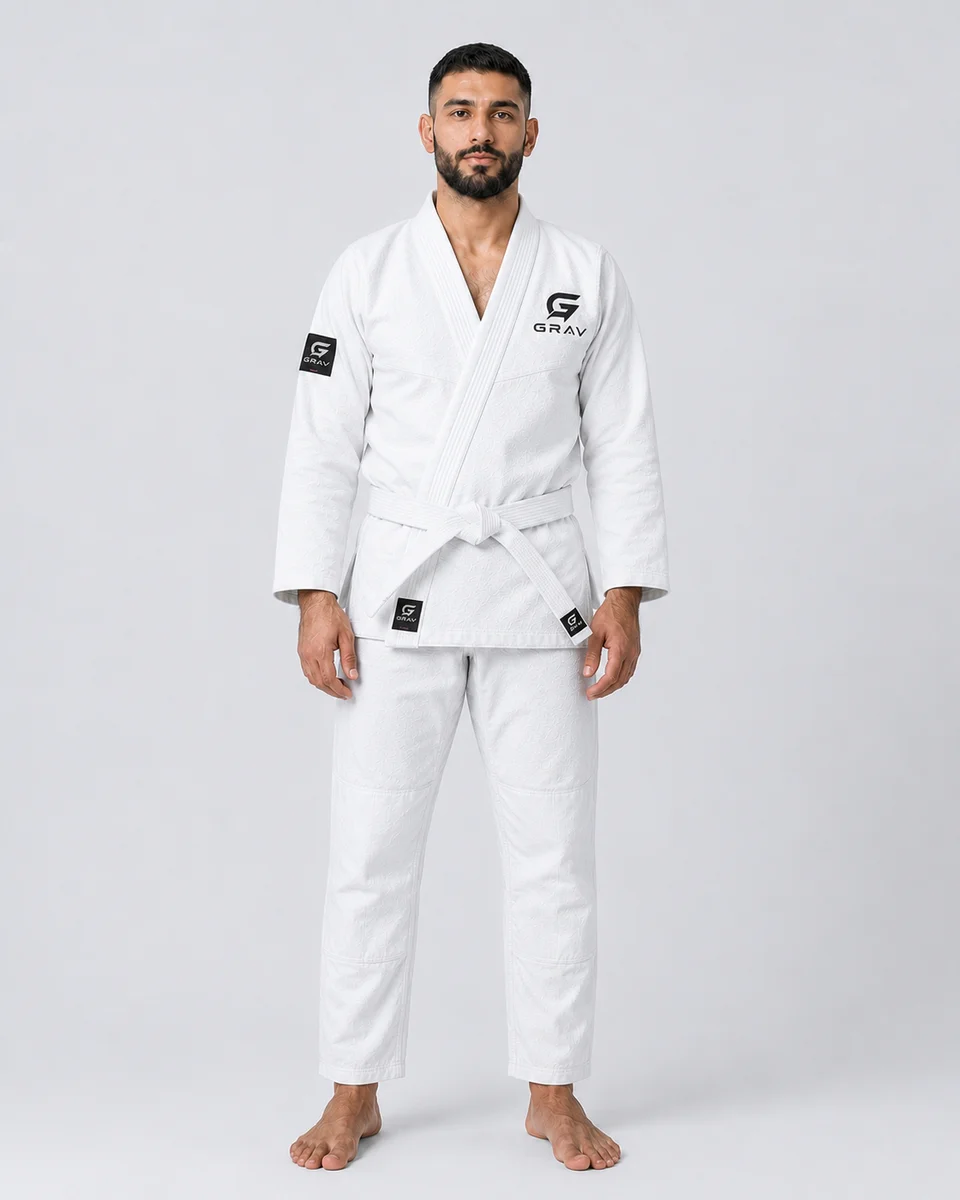 GRAV Meridian 450 BJJ gi in Bone, worn with a black belt
