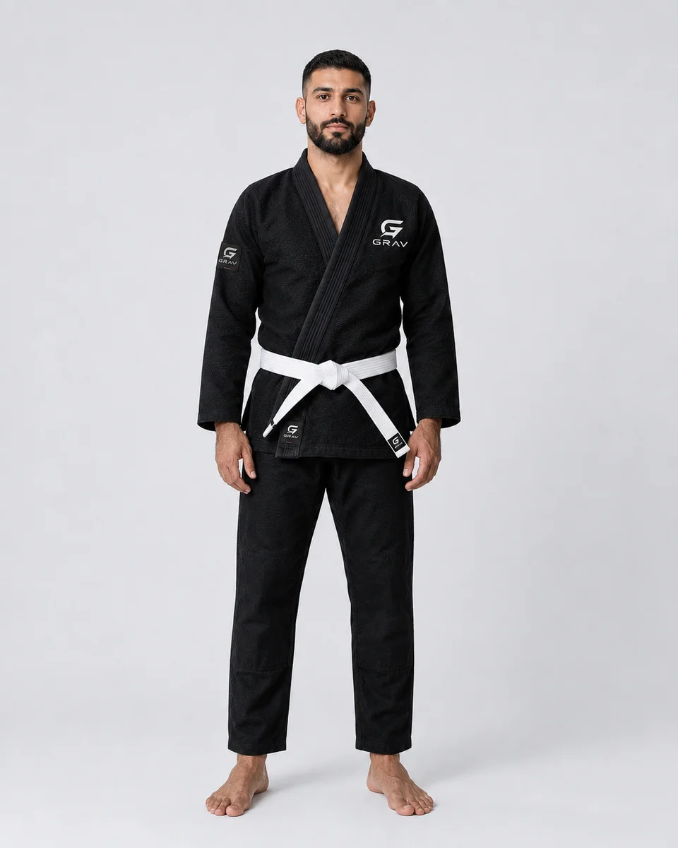 GRAV Vector Comp BJJ gi in Onyx black, worn with a black belt