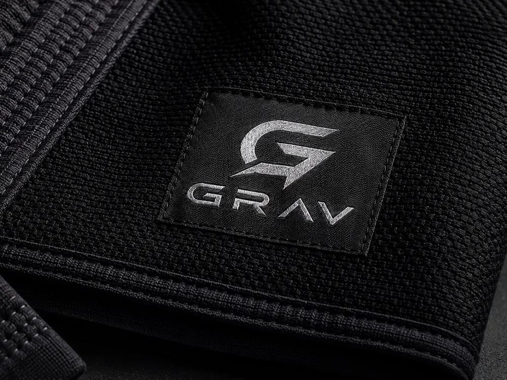 Close detail of a GRAV gi — woven label and pearl weave stitching